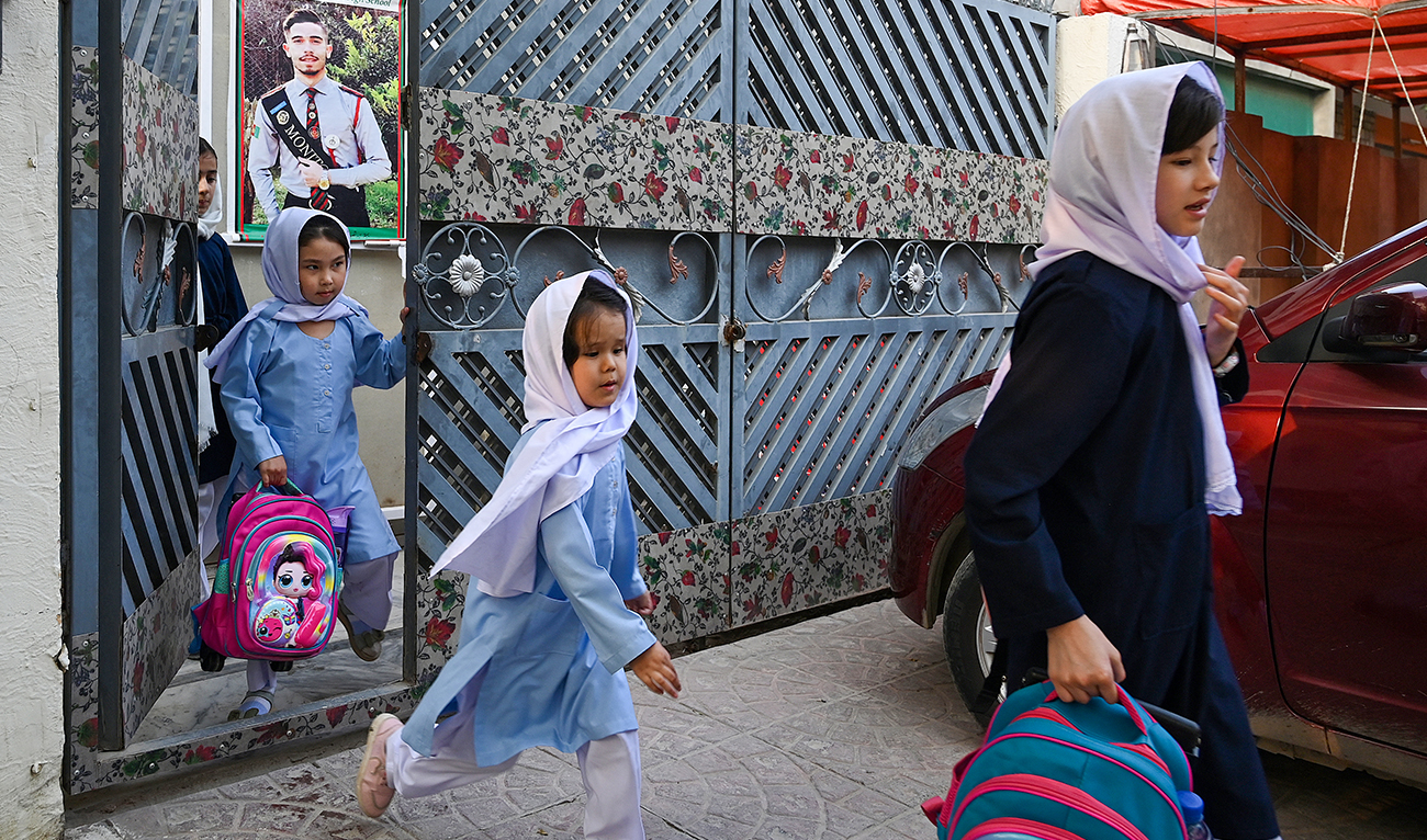 Afghan refugee girls leave after class at Estiqlal Lycee High School in Islamabad on October 30, 2023. (AFP)