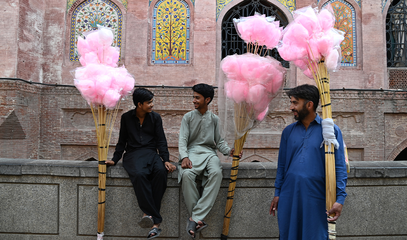 Cotton candy sellers wait for customers outside the Wazir Khan mosque in Lahore on October 20, 2023. (AFP/File)