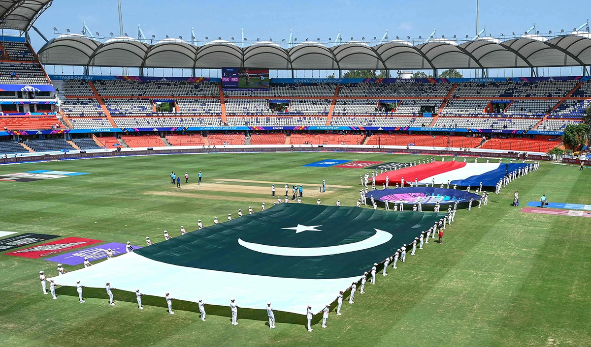 Volunteers hold Netherlands' and Pakistan's flags for national anthems before the start of the 2023 ICC Men's Cricket World Cup one-day international (ODI) match at the Rajiv Gandhi International Stadium in Hyderabad, India on October 6, 2023. (AFP)
