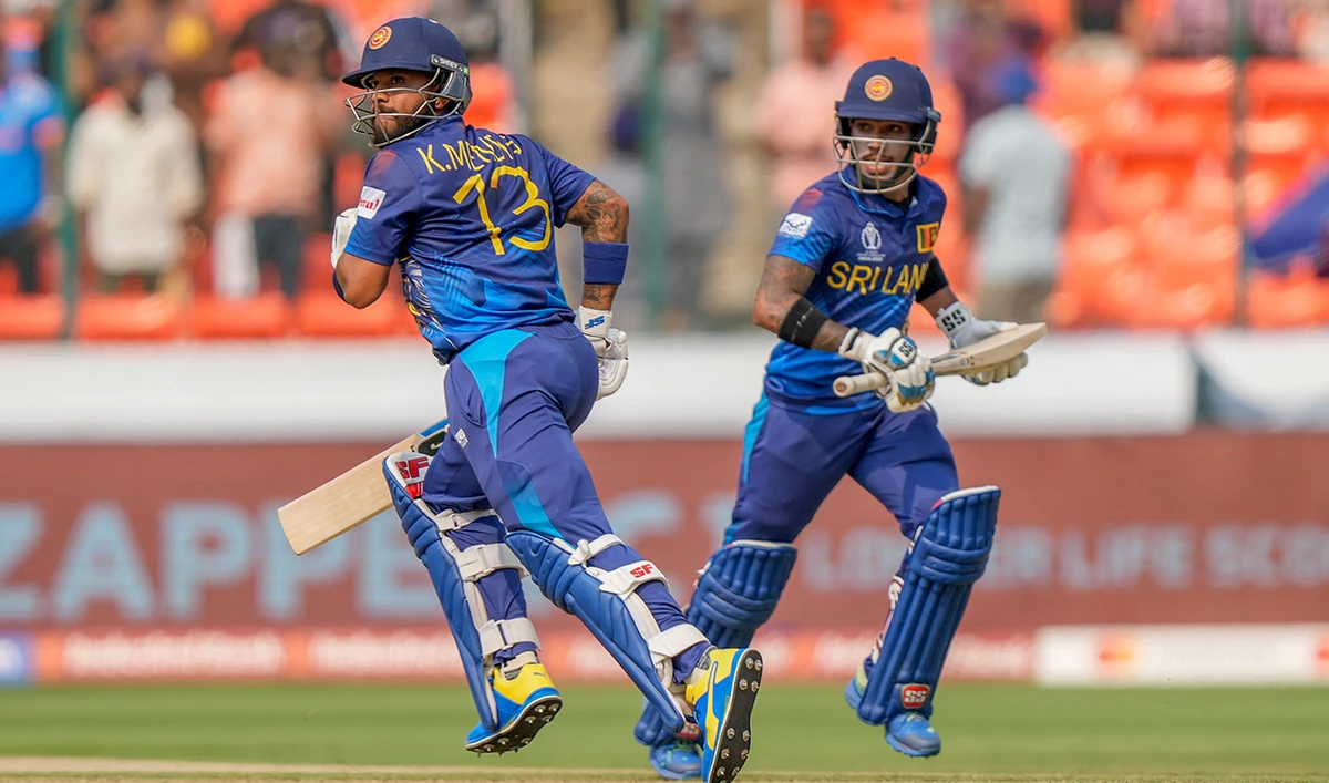 Sri Lanka's Kusal Mendis, left, and his batting partner Pathum Nissanka run between the wickets during the ICC Cricket World Cup match between Pakistan and Sri Lanka in Hyderabad, India, Tuesday, Oct. 10, 2023. (AP)