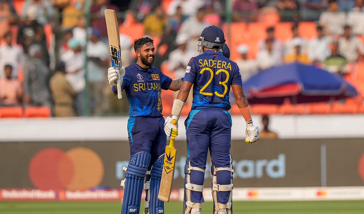 Sri Lanka's Kusal Mendis celebrates his century with teammate Sadeera Samarawickrama during the ICC Cricket World Cup match between Pakistan and Sri Lanka in Hyderabad, India on October 10, 2023. (AP)