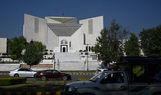 Motorists drive past Pakistan's Supreme Court in Islamabad on April 5, 2022. (AFP/File)