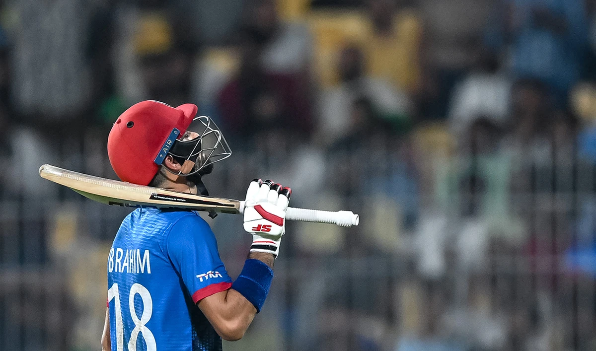 Afghanistan's Ibrahim Zadran gestures as he walks back to the pavilion after his dismissal during the 2023 ICC Men's Cricket World Cup one-day international (ODI) match between Pakistan and Afghanistan at the MA Chidambaram Stadium in Chennai on October 23, 2023. (AFP/File)