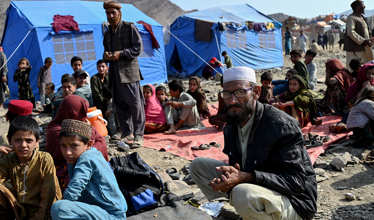 Afghan refugees rest at a makeshift camp upon their arrival from Pakistan, near the Afghanistan-Pakistan Torkham border in Nangarhar province on November 2, 2023. (AFP)