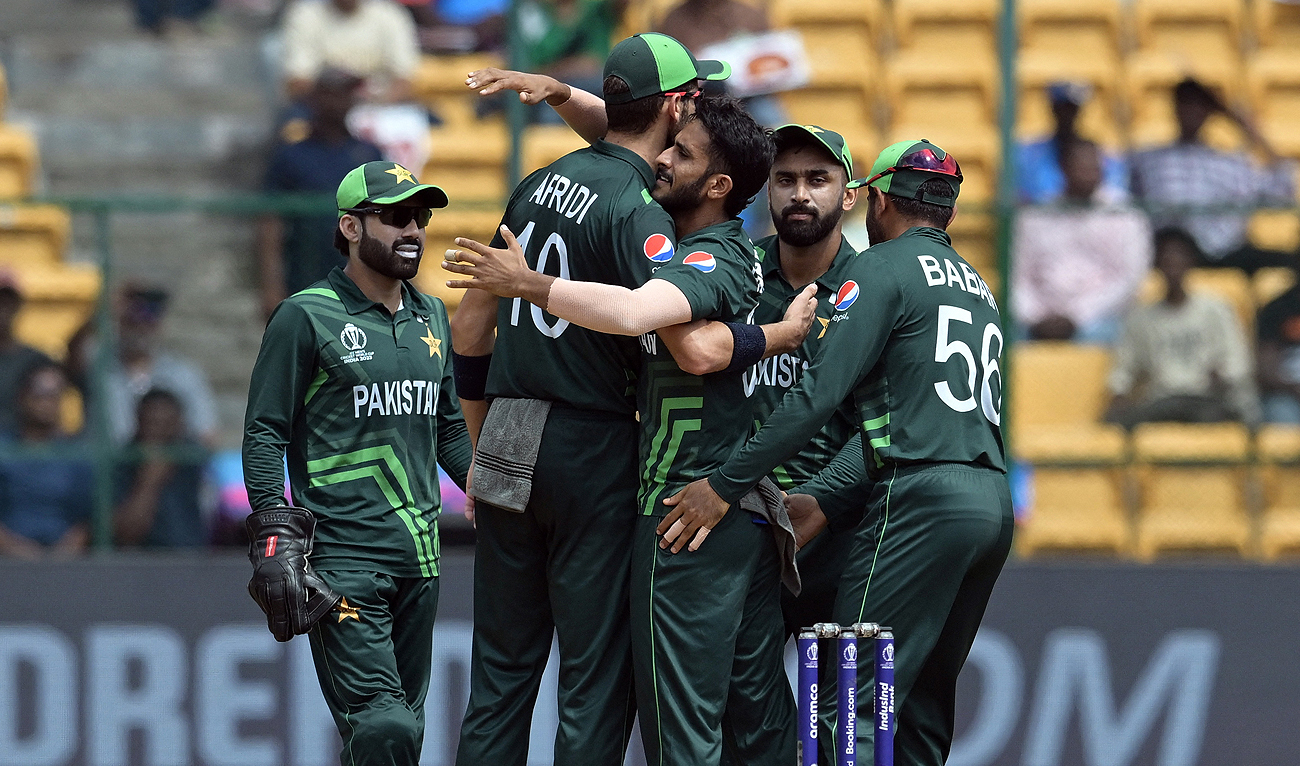 Pakistan's Hasan Ali celebrates taking the wicket of New Zealand's Devon Conway with teammates during the ICC Men's Cricket World Cup match between New Zealand and Pakistan in Bengaluru, India, Saturday, Nov. 4, 2023. (REUTERS)