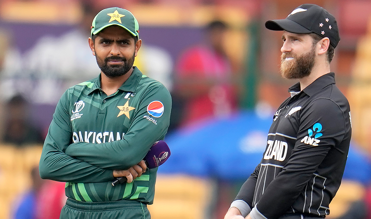 New Zealand's captain Kane Williamson and Pakistan's captain Babar Azam wait for the coin toss before the start of the ICC Men's Cricket World Cup match between New Zealand and Pakistan in Bengaluru, India, Saturday, Nov. 4, 2023. (AP)