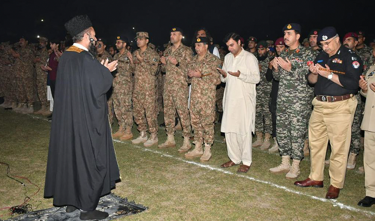 In this handout photo, taken and released by Pakistan's Inter-Service Public Relations (ISPR), military personnel offer funeral prayers for security officials who were killed during an intelligence-based operation in Tirah Valley of Khyber district on November 6, 2023. (Photo courtesy: ISPR)