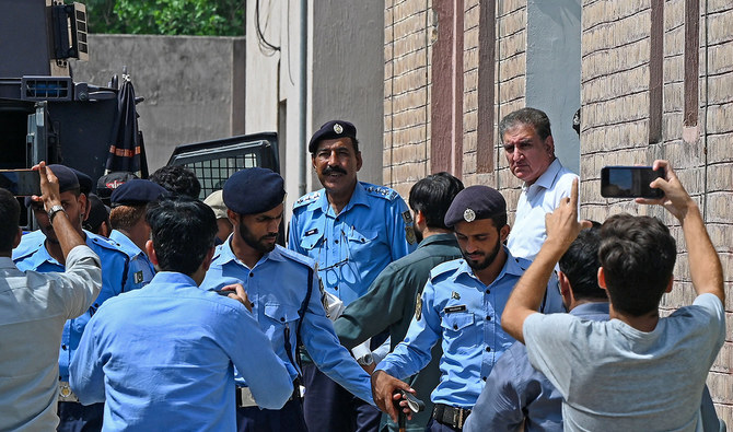 Shah Mahmood Qureshi, Vice Chairman of Pakistan Tehreek-e-Insaf (PTI) party and Pakistan's former Foreign Affairs Minister is seen outside a special court after he was granted a four-day physical remand in Islamabad on August 21, 2023. (AFP/File)