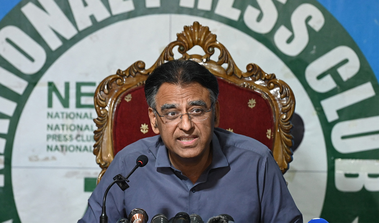 Pakistan's former finance minister Asad Umar speaks during a press conference after he was released from prison, to announce stepping down from his party position, in Islamabad on May 24, 2023. (AFP/File)