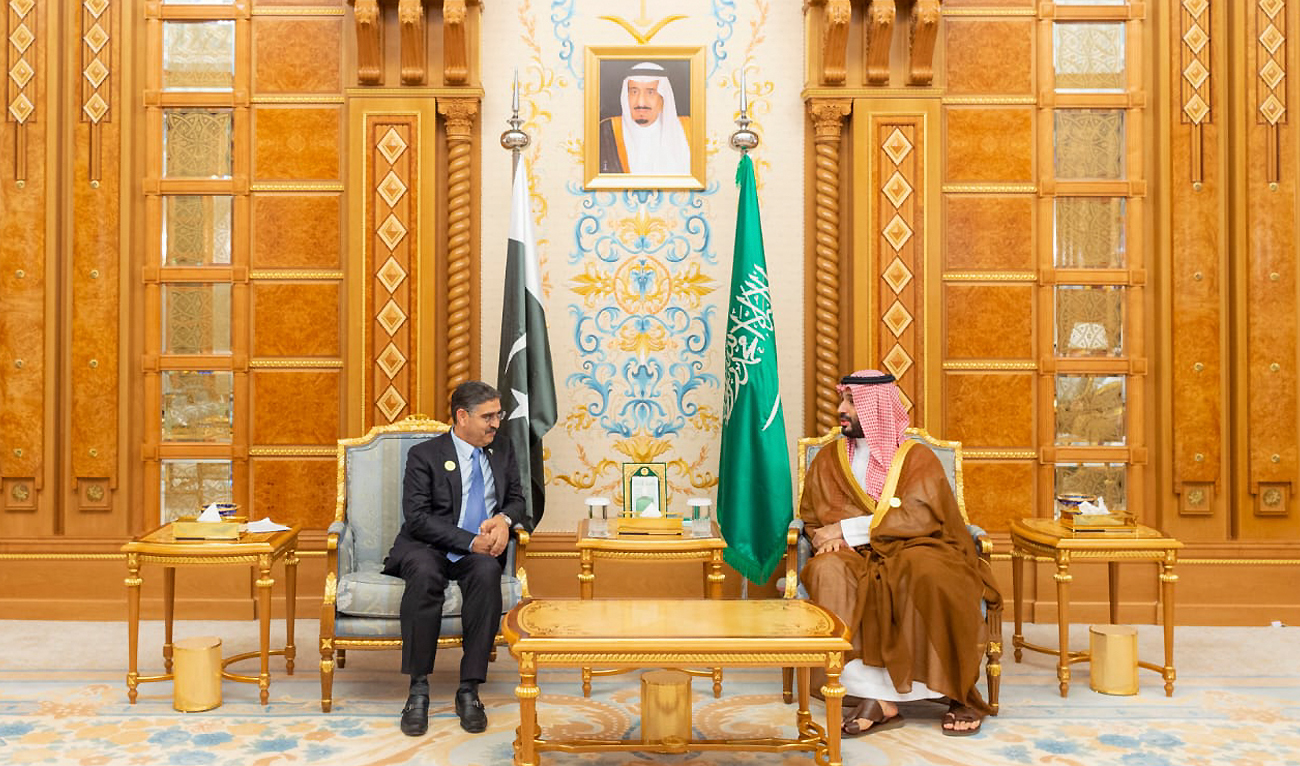 In this handout photo, taken and released by the Prime Minister's Office, Pakistan's Caretaker Prime Minister Anwar-Ul-Haq Kakar(left) meets Saudi Crown Prince Mohammed bin Salman at the sidelines of an Organization of Islamic Cooperation (OIC) summit in Riyadh on November 11, 2023. (Photo courtesy: X/@PakPMO)