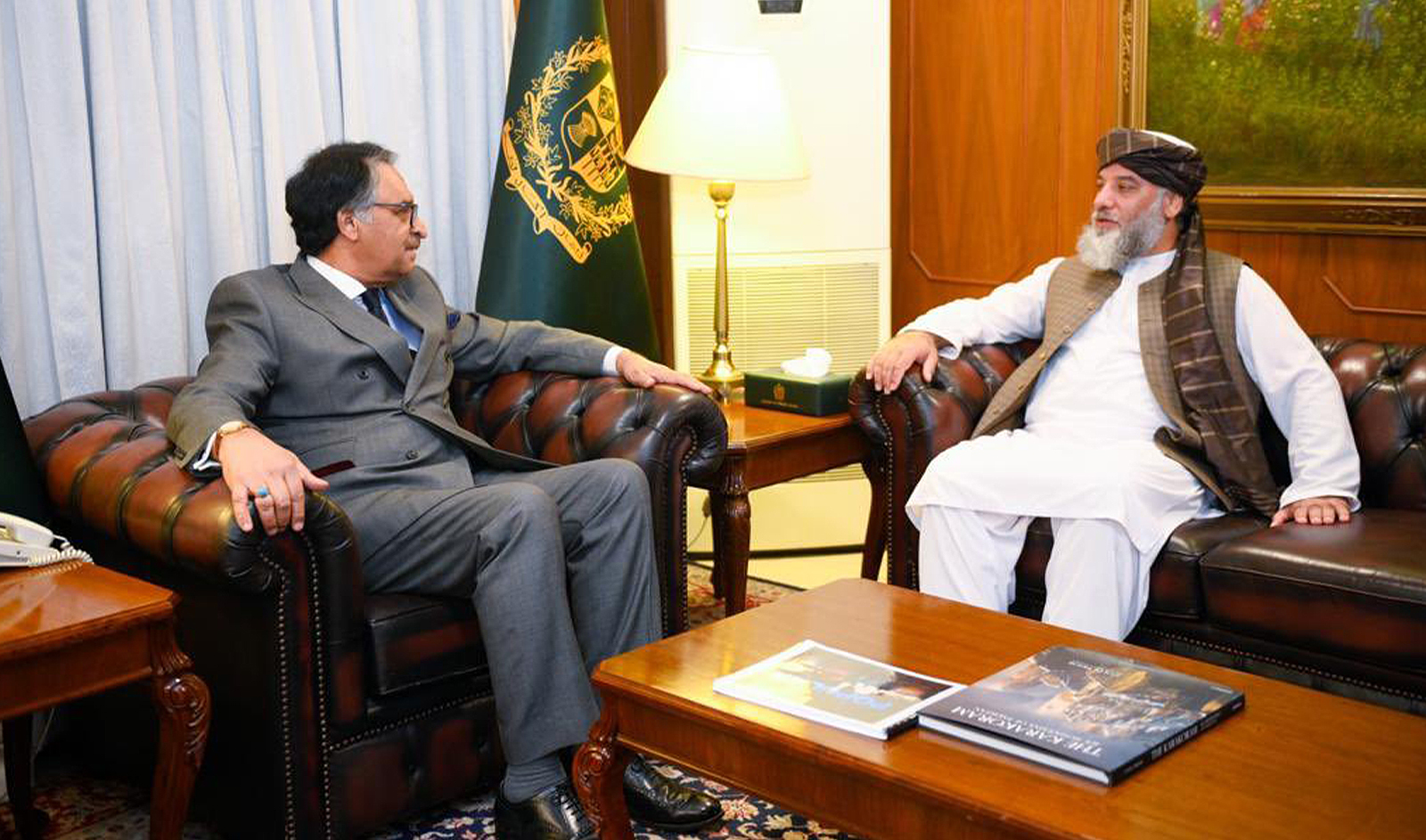 Pakistan's caretaker Foreign Minister Jalil Abbasi Jilani (left) meets Afghan commerce minister Hajji Nooruddin Azizi in Islamabad, Pakistan on November 14, 2023. (Pakistan's Foreign Office)