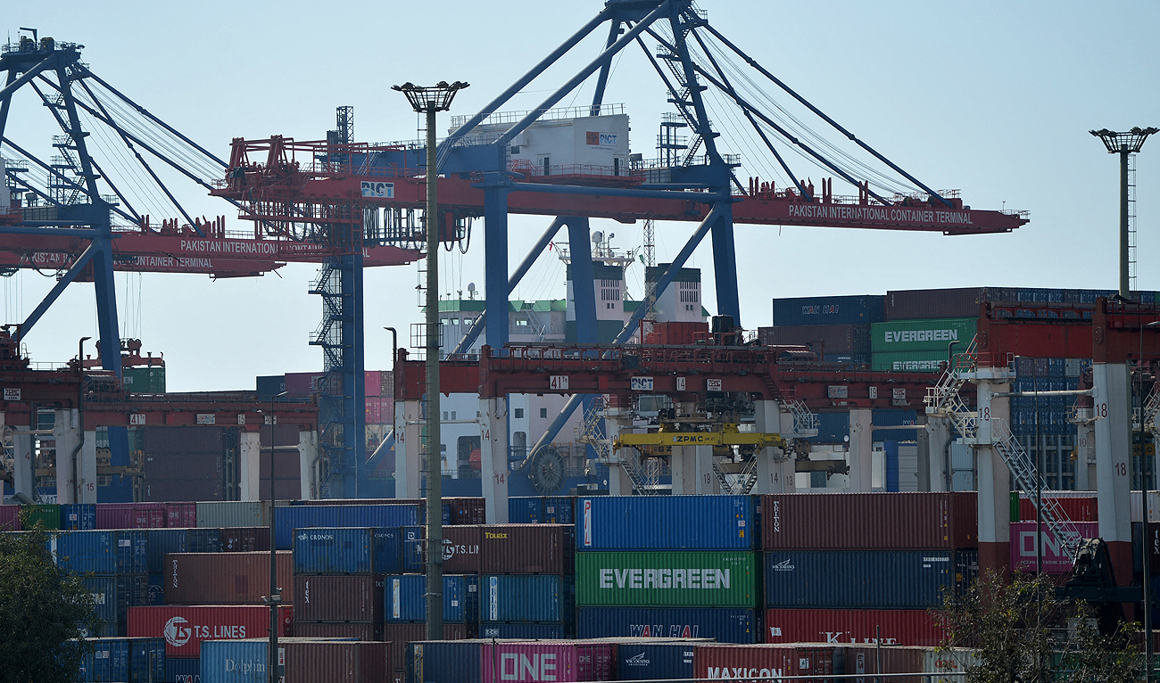 In this picture taken on January 11, 2023, shipping containers are seen placed under cranes at the Karachi sea port. (AFP/File)