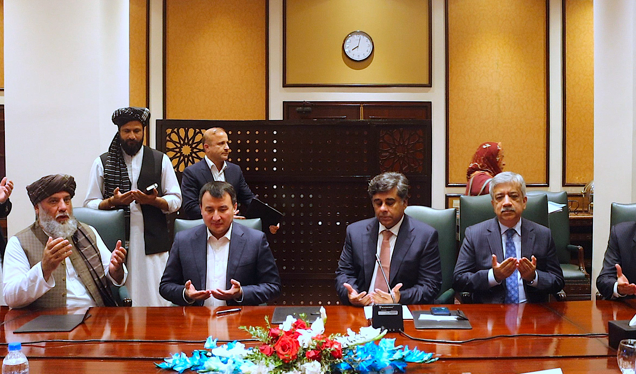 This handout photo, taken and released by the Afghanistan Embassy in Islamabad, shows Pakistan's interim commerce minister Dr Gohar Ejaz (2nd right) with his Afghan counterpart, Hajji Nooruddin Azizi (left) and Uzbekistan's Deputy Prime Minister, Dr. Jamshid Khodjaev (2nd left), during the first trilateral meeting between the three nations in Islamabad on November 14, 2023. (Photo courtesy: X/@AfghanembassyI1)