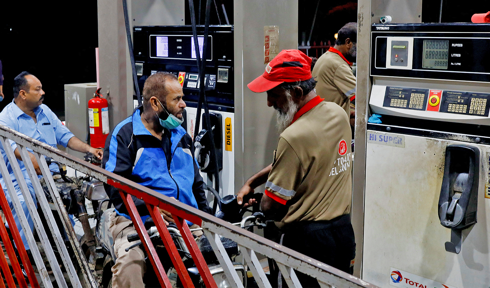 People get fuel at a petrol station after the government announced the increase of petrol and diesel prices, in Karachi, Pakistan on September 16, 2023. (REUTERS/File)