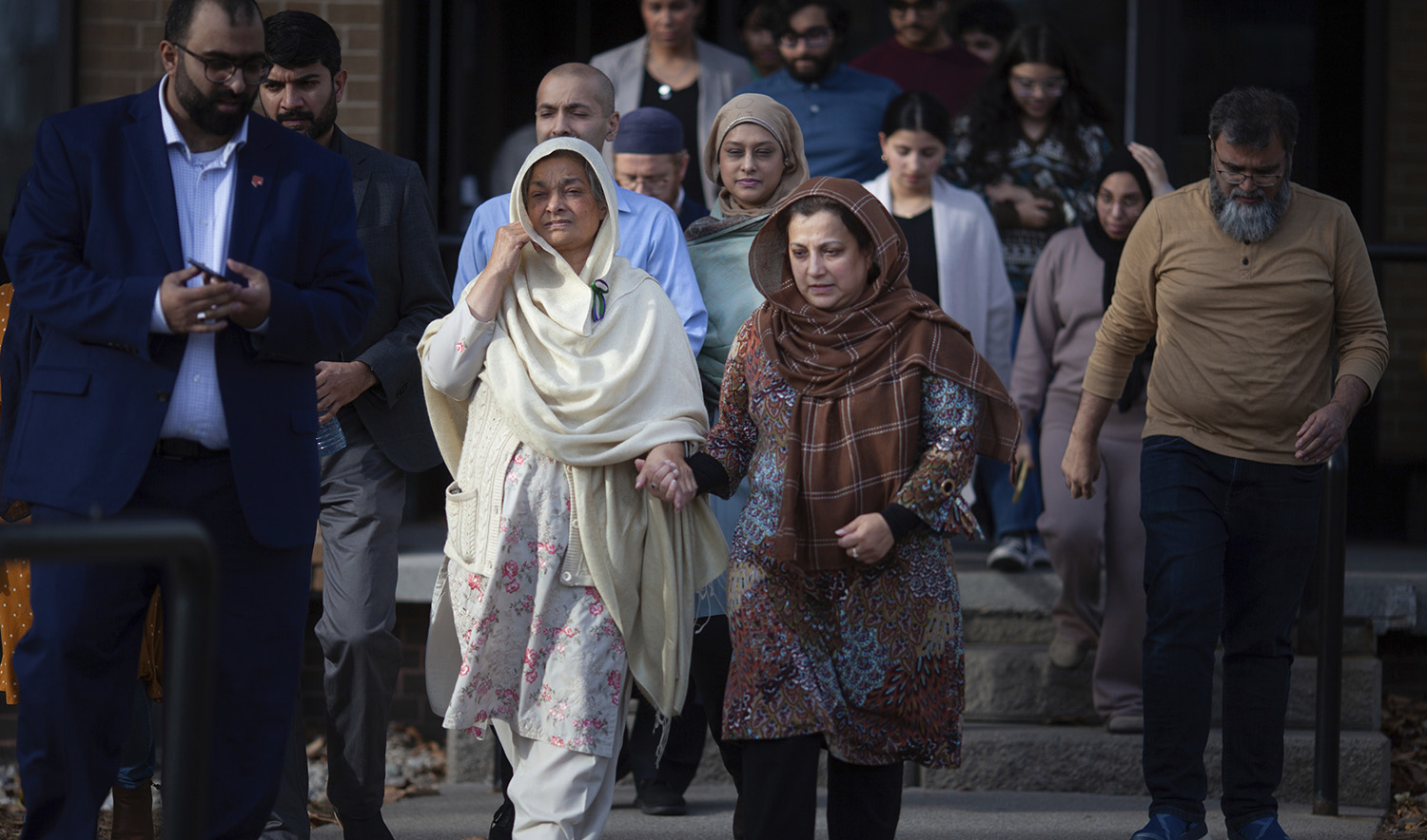 Family and friends of the Afzaal family exit the Superior Court of Justice after a verdict in the Nathaniel Veltman murder trial was reached, on November 16, 2023, in Windsor, Canada. (The Canadian Press via AP)