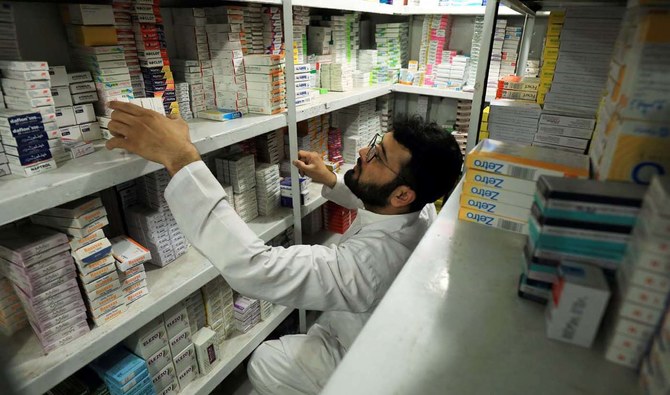 A man sorts and arranges medicine packs at a pharmacy store in Peshawar on March 28, 2019. (REUTERS/File)