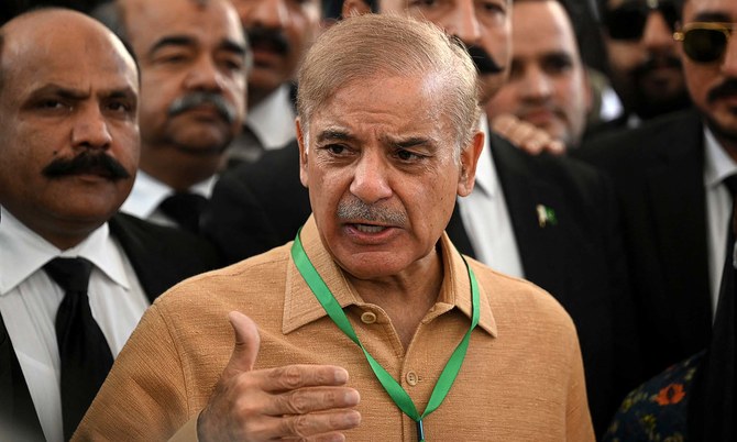 Shehbaz Sharif, center, speaks with the media before attending a hearing outside the Supreme Court building in Islamabad, Pakistan, on April 7, 2022. (AFP)