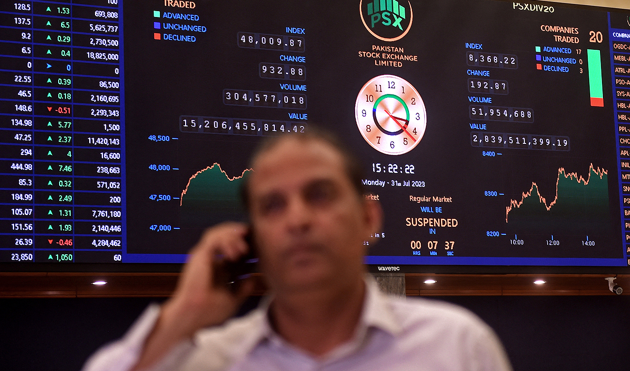 In this file photo, taken on July 31, 2023, a stock broker attends a call during a trading session at the Pakistan Stock Exchange (PSX) in Karachi. (AFP/File)