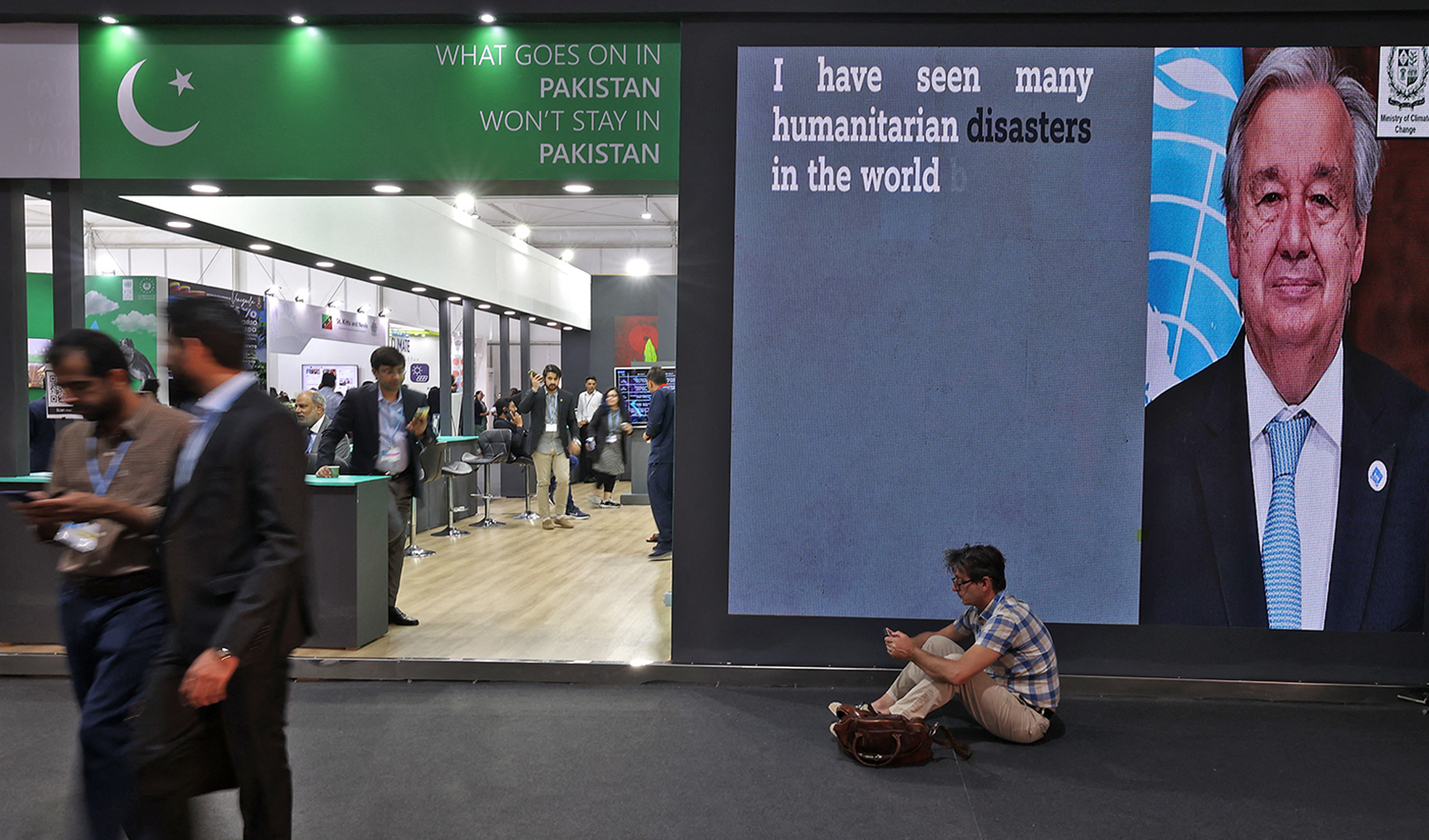 Participants visit the Pakistan pavillon at the Sharm el-Sheikh International Convention Centre, in Egypt's Red Sea resort city of the same name, during the COP27 climate conference, on November 14, 2022. (AFP/File)