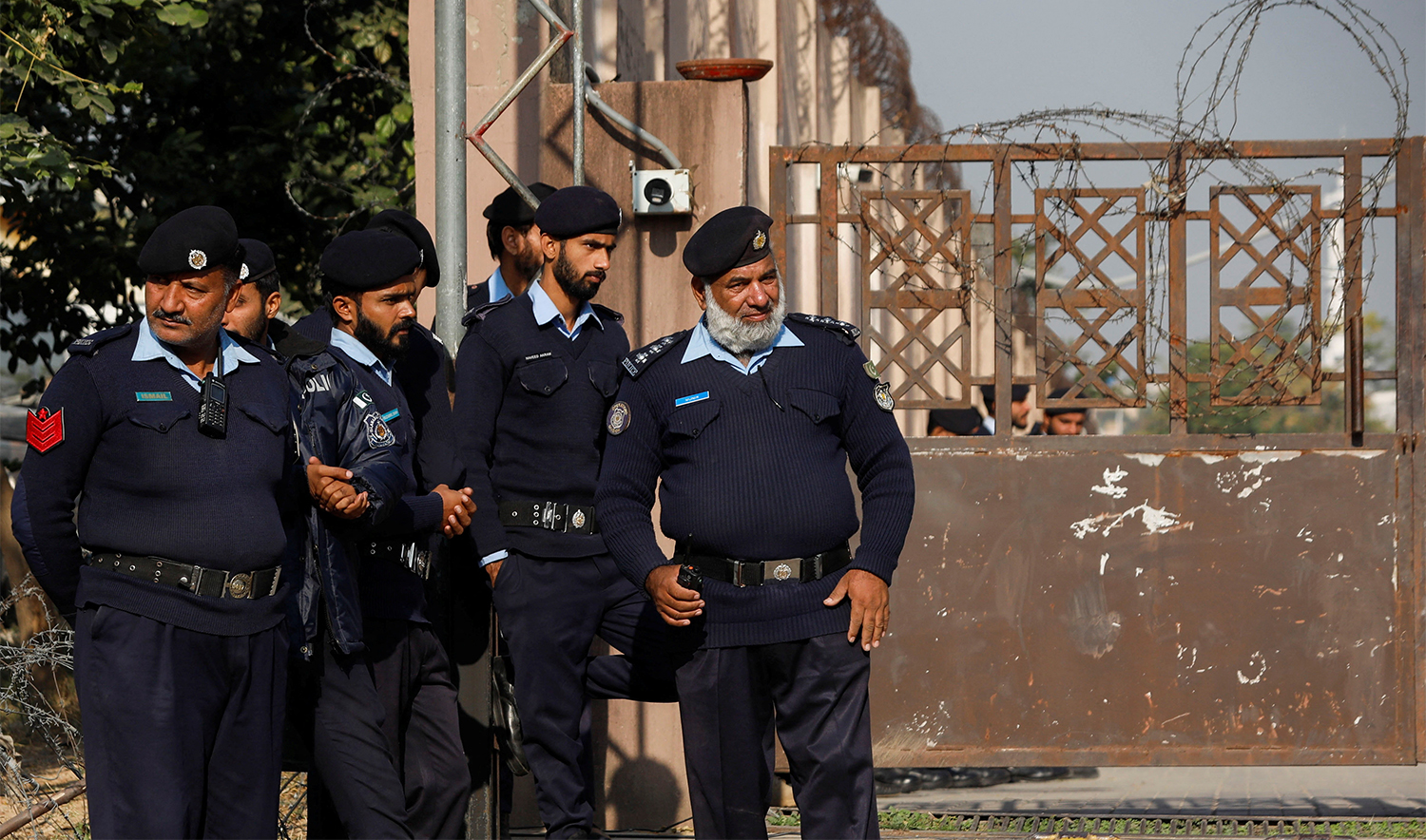 Police officers stand at the entrance of the district Judicial Complex in Islamabad, Pakistan November 28, 2023. (REUTERS)