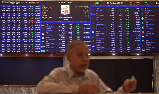 A stock broker watches share prices during a trading session at the Pakistan Stock Exchange (PSX) in Karachi on July 31, 2023. (AFP/File)