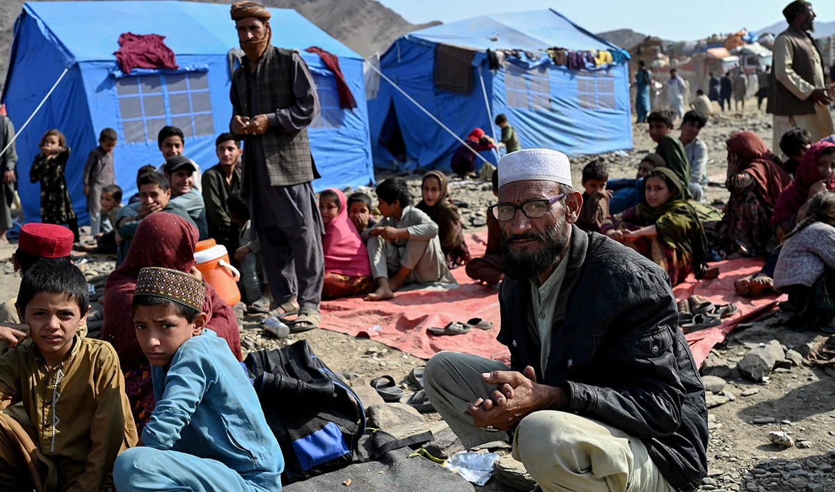 Afghan refugees rest at a makeshift camp upon their arrival from Pakistan, near the Afghanistan-Pakistan Torkham border in Nangarhar province on November 2, 2023. (AFP)