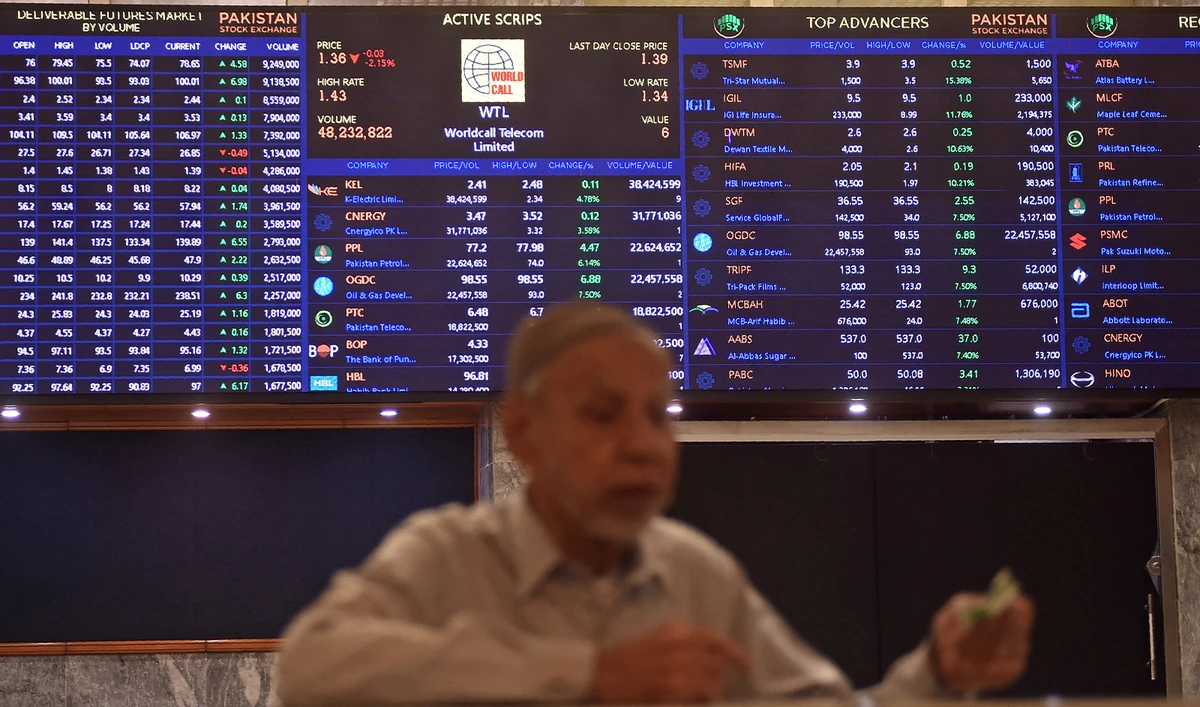 A stock broker watches share prices during a trading session at the Pakistan Stock Exchange (PSX) in Karachi on July 31, 2023. (AFP/File)