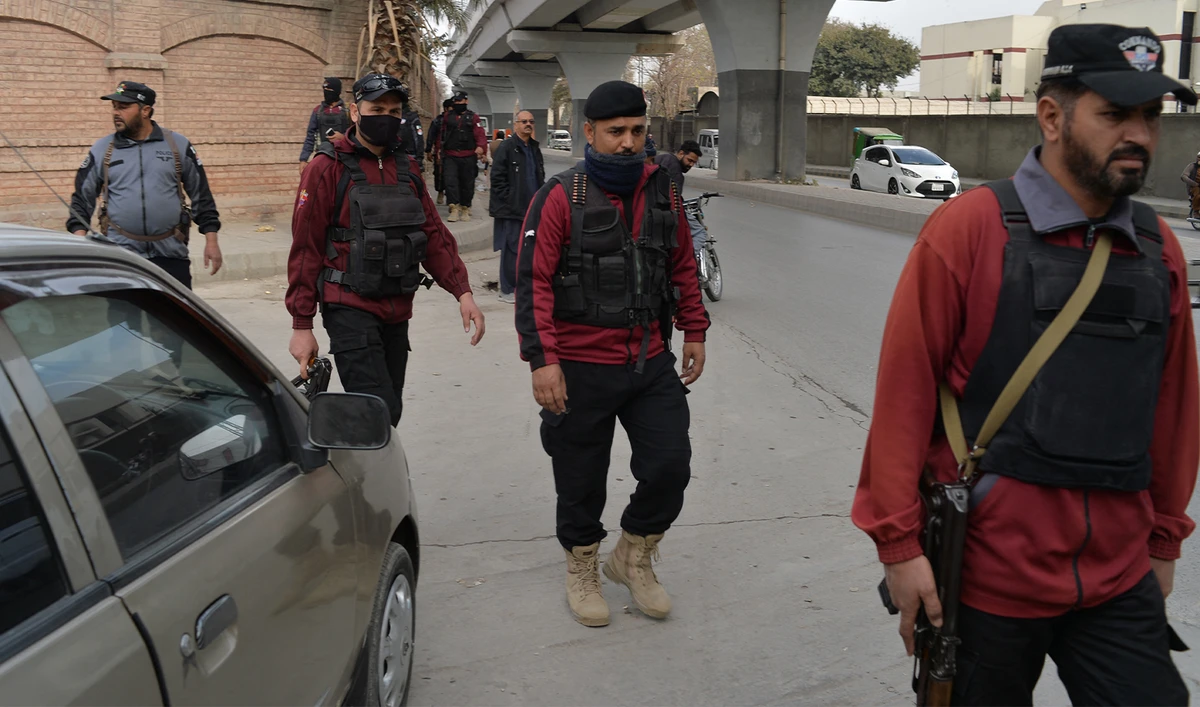Policemen patrol along a street in Peshawar, Pakistan, on February 1, 2023. (AFP/File)