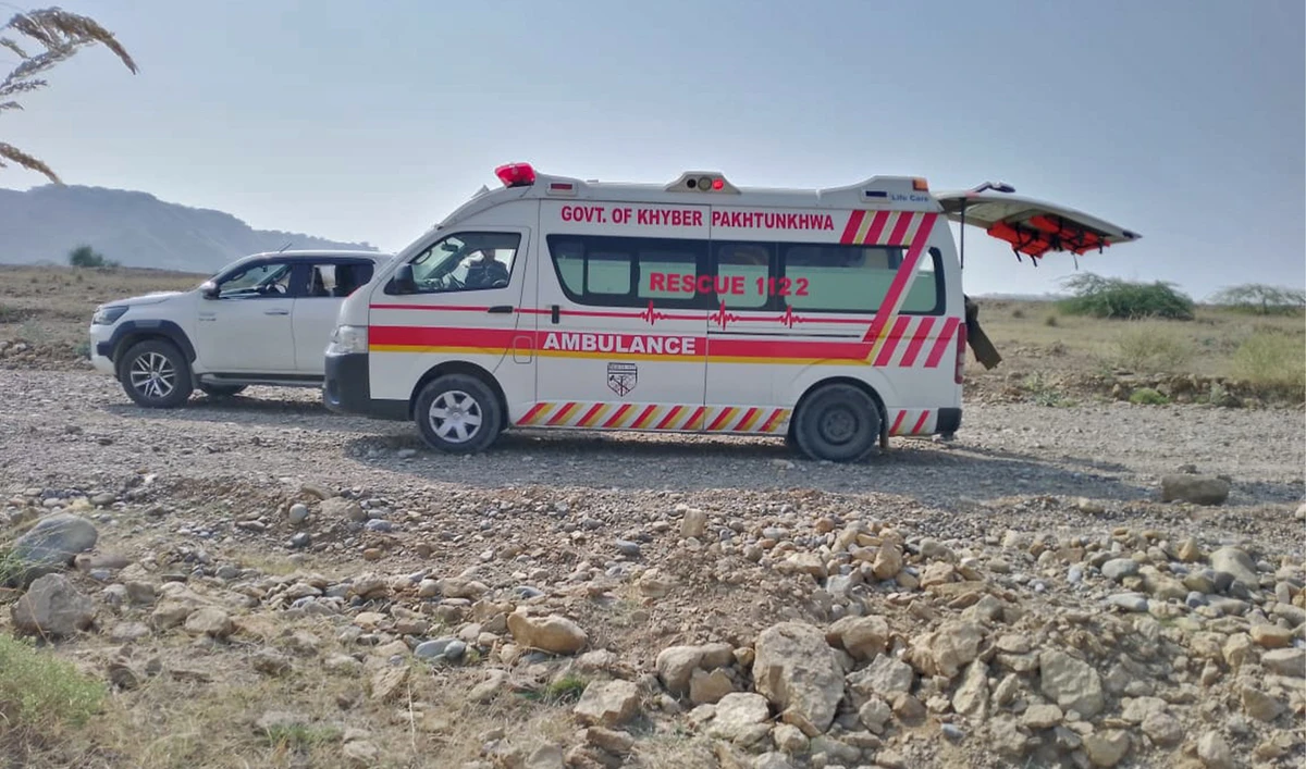 An ambulance is parked at the attack site in which two people were killed and 11 injured when militants attacked vehicles carrying the employees of a Pakistani conglomerate in Dera Ismail Khan, Pakistan, on November 13, 2023. (Photo courtesy: Rescue 1122)