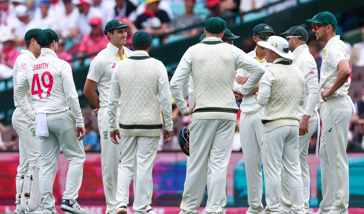 Australian captain Pat Cummins (C) stands with teammates before the start of play during the third cricket Test match between Australia and South Africa at the Sydney Cricket Ground (SCG) in Sydney on January 7, 2023. (AFP/File)
