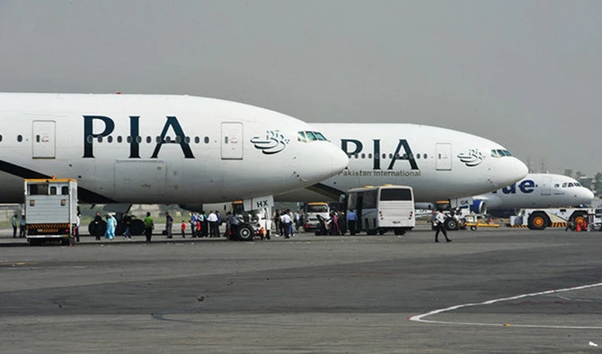 Pakistan International Airline (PIA) planes are positioned on the tarmac at the Benazir Bhutto International Airport in Islamabad on October 10, 2012. (AFP/File)