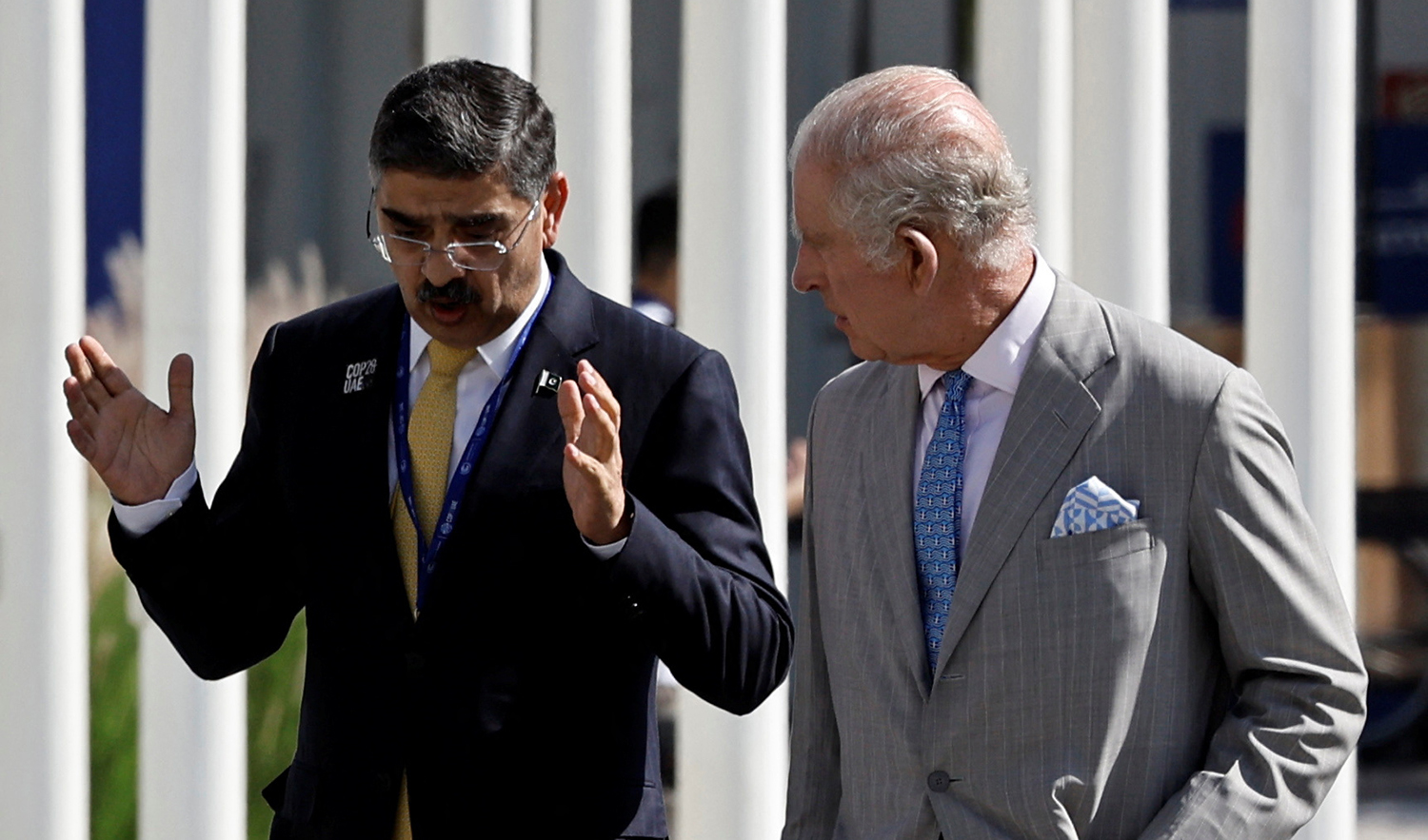 Britain's King Charles speaks with Prime Minister of Pakistan Anwaar-ul-Haq Kakar, as they walk to pose for a family photo during the United Nations Climate Change Conference (COP28) in Dubai, United Arab Emirates, December 1, 2023. (REUTERS)