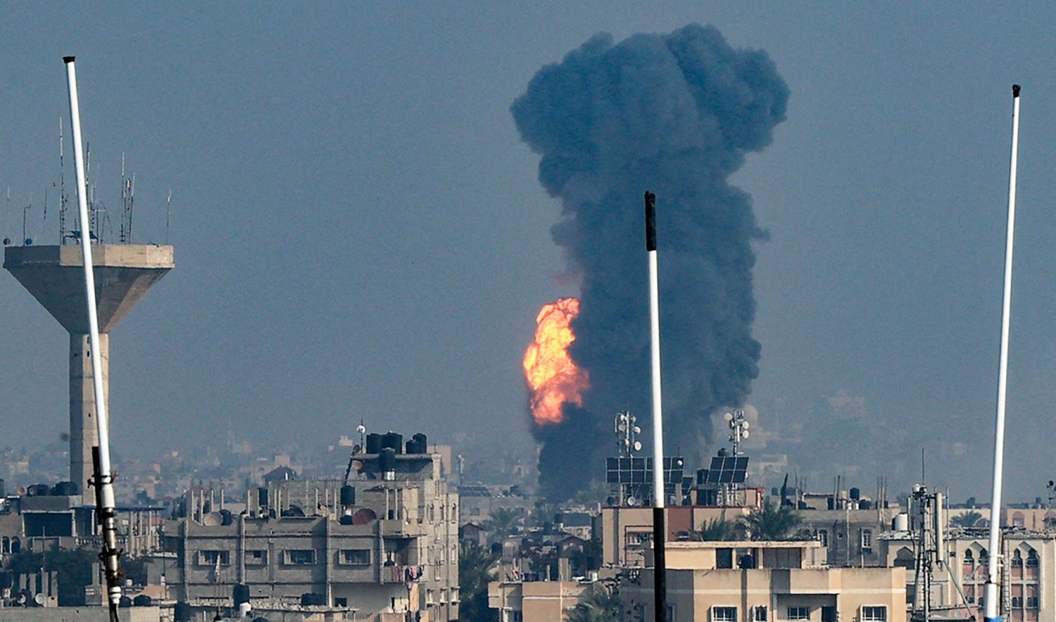 Smoke rises above buildings during an Israeli strike on Rafah in the southern Gaza Strip on December 1, 2023. (AFP)
