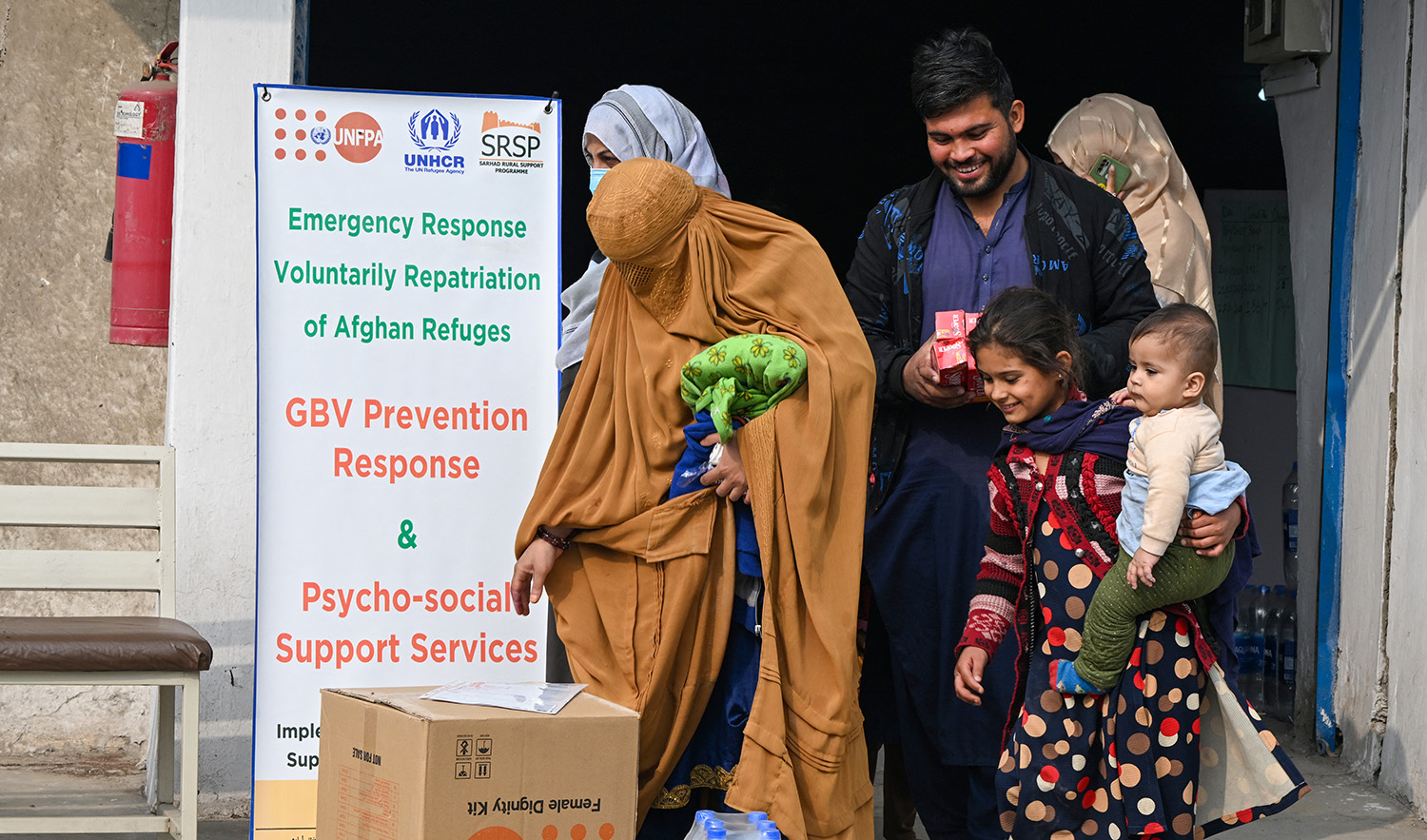 This photo taken on November 23, 2023 shows Afghan refugees leaving the United Nations High Commissioner for Refugees (UNHCR) Azakhel Voluntary Repatriation Centre in Nowshera. (AFP/File)