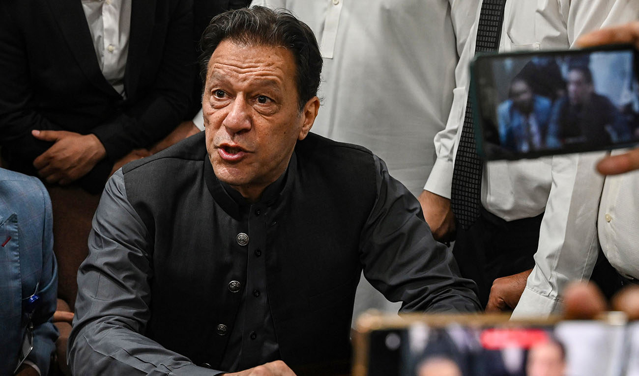 Pakistan's former prime minister, Imran Khan gestures after arriving at a registrar office in High court in Lahore, Pakistan on July 3, 2023. (AFP/File)
