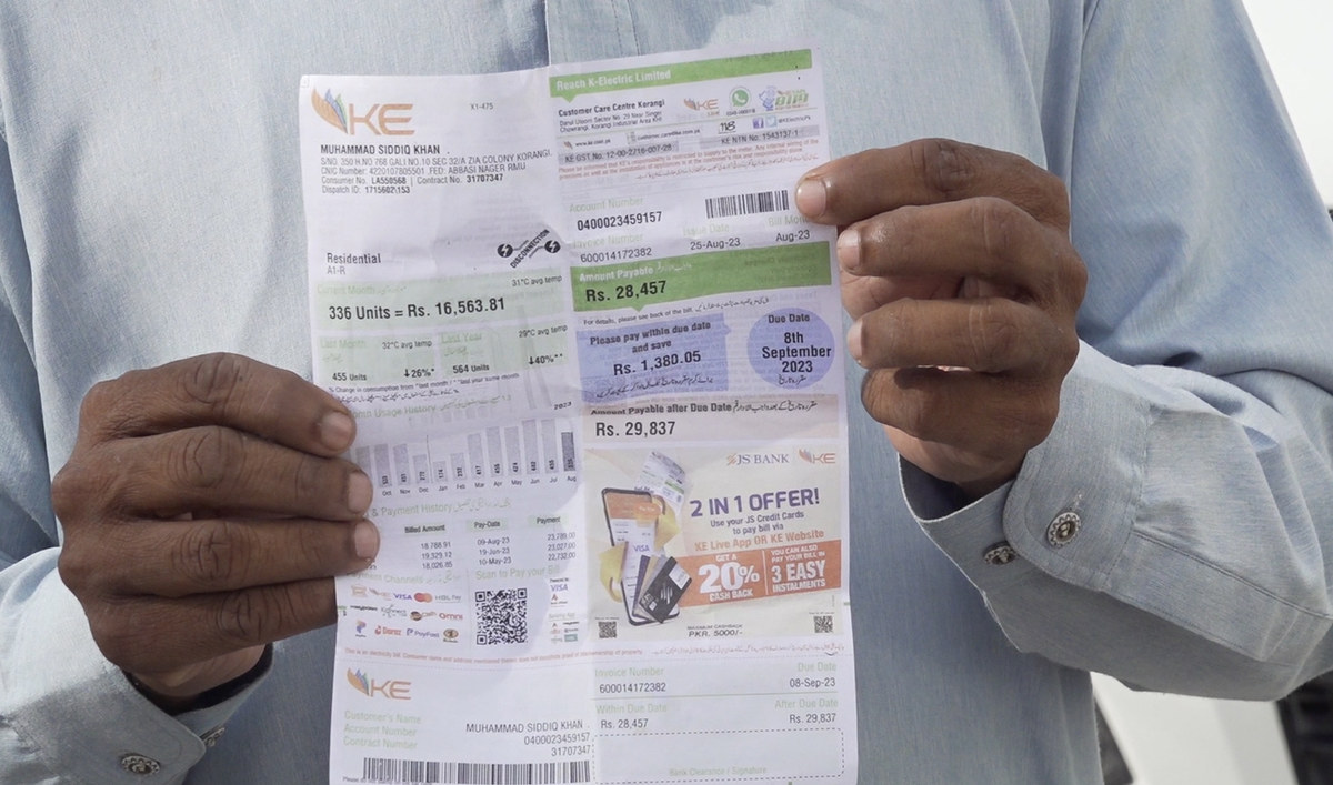 Muhammad Amir Khan, a driver with a private company, holds his electricity bill of Rs28,457 ($95.99) on September 18, 2023, in Karachi, Pakistan. (AN photo)