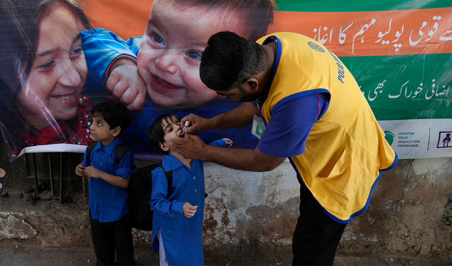 A health worker administers a polio vaccine to a child at a neighborhood of Lahore, Pakistan, on October 2, 2023. (AP/File)