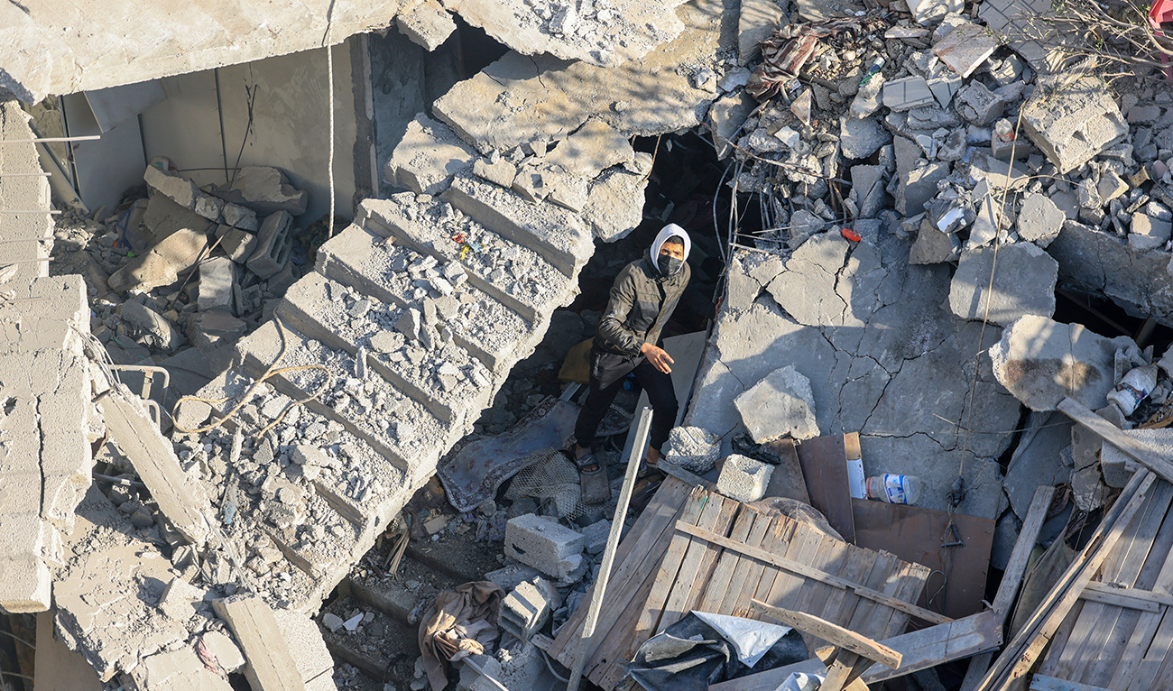 A man walks among the rubble of a building destroyed destroyed Israeli bombardment overnight in Rafah on the southern Gaza Strip on December 7, 2023, amid continuing battles between Israel and the Palestinian militant group Hamas. (AFP)