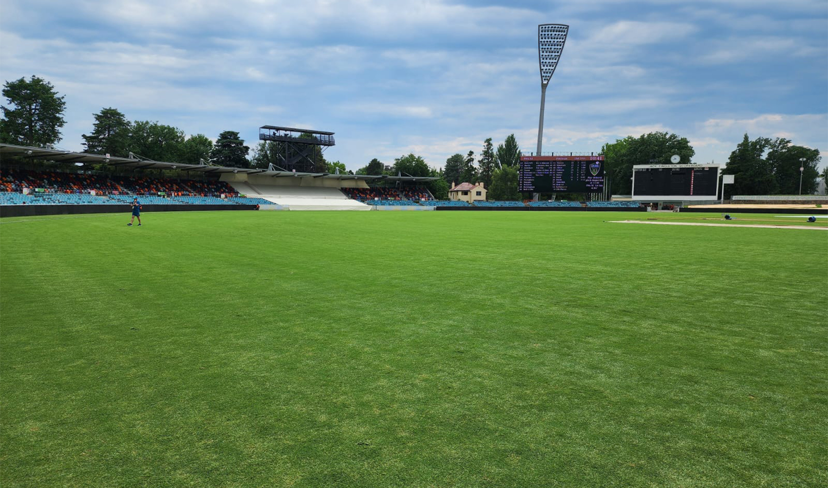 A man inspects the ground after day four of the Pakistan vs Prime Minister's XI Test match was delayed due to a wet outfield in Canberra, Australia, on December 9, 2023. (Pakistan Cricket Board)