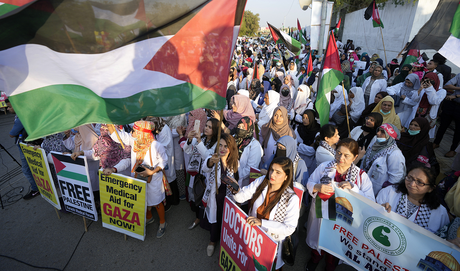 Supporters of Karachi media forum chant slogans during a demonstration against Israeli airstrikes on Gaza, and to show solidarity with Palestinian people, in Karachi, Pakistan, on December 10, 2023. (AP)