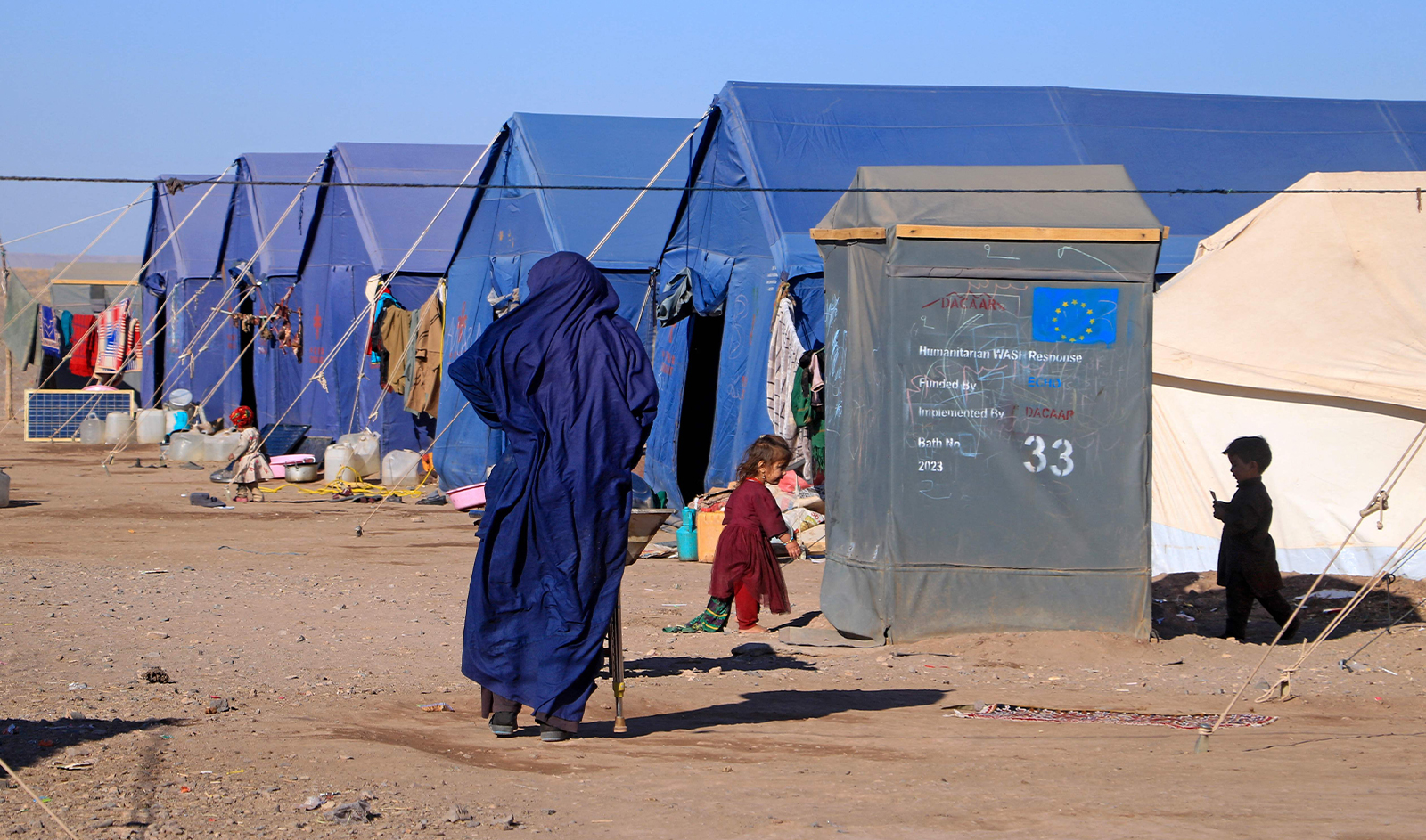 Afghan children play near their makeshift tents at Nayeb Rafi village in Zendeh Jan district of Herat province on December 10, 2023. (AFP/File)