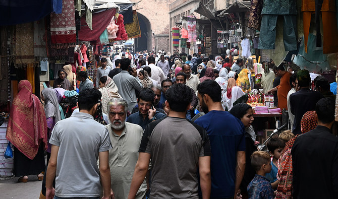 In this picture taken on April 16, 2023, people throng a market area during shopping in Lahore. (AFP/File)