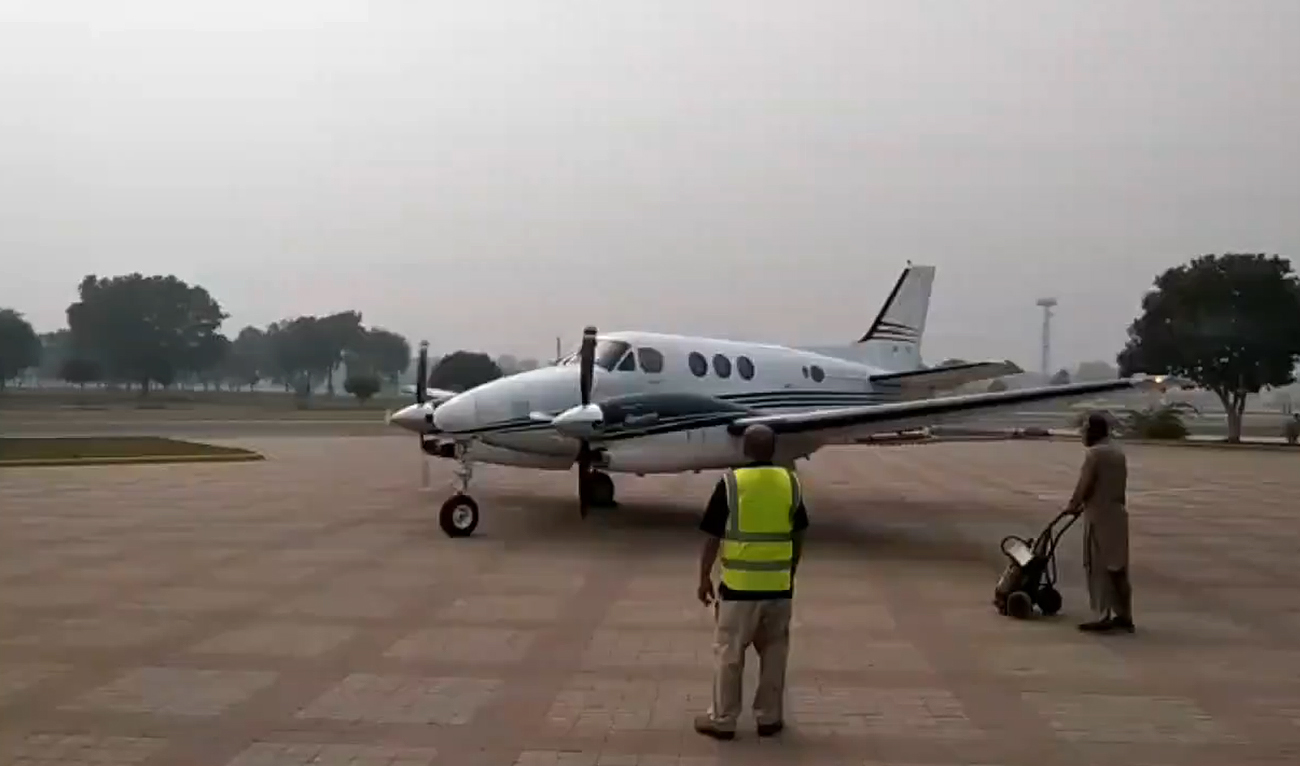 This screengrab, taken from a handout video released by Pakistan's Punjab government, shows aircraft preparing for takeoff to induce artificial rain in Lahore on December 16, 2023. (Photo courtesy: Punjab government)