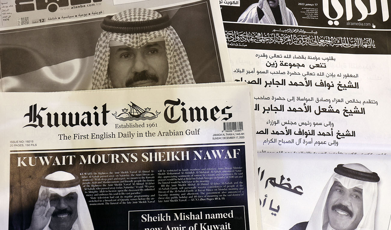 This picture taken on December 17, 2023 in Kuwait City shows a collection of Kuwaiti newspaper front pages, headlines featuring the death of Kuwait's Amir Sheikh Nawaf al-Ahmad Al-Sabah. (AFP)