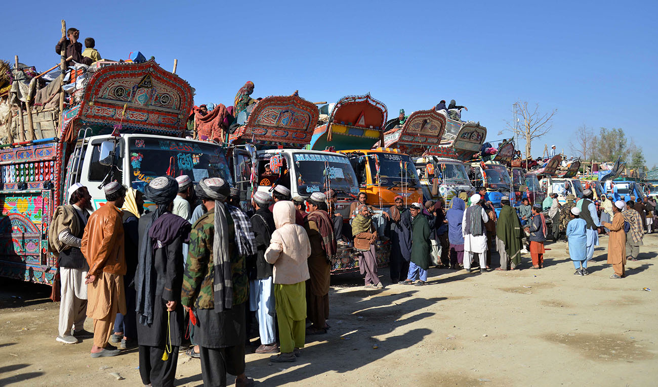 Afghan refugees along with their belongings arrive on trucks from Pakistan, near the Afghanistan-Pakistan border in the Spin Boldak district of Kandahar province on November 20, 2023. (AFP/File)