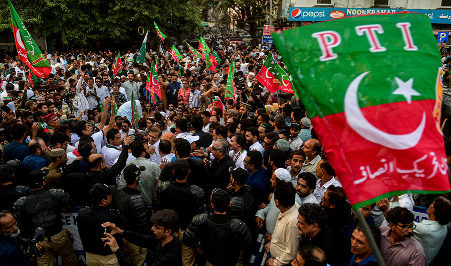 This representational file photo shows supporters of Pakistan Tehreek-e-Insaf party protest on a street against the disqualified decision of former prime minister Imran Khan in Karachi on October 21, 2022. (AFP/File)