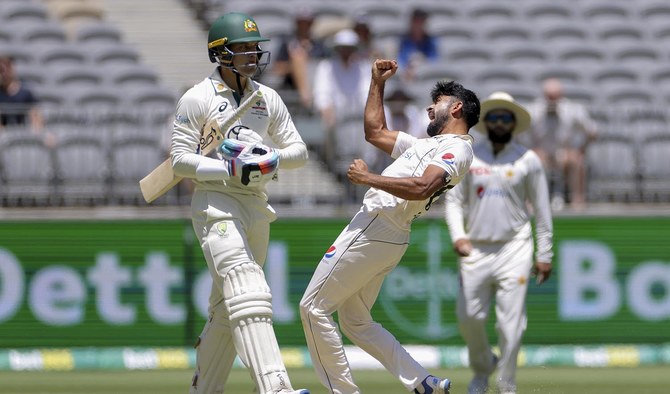 Aamir Jamal of Pakistan celebrates after taking the wicket of Alex Carey, left, of Australia during play on the second day of the first cricket test between Australia and Pakistan in Perth, Australia, on December 15, 2023. (AAP Image via AP)