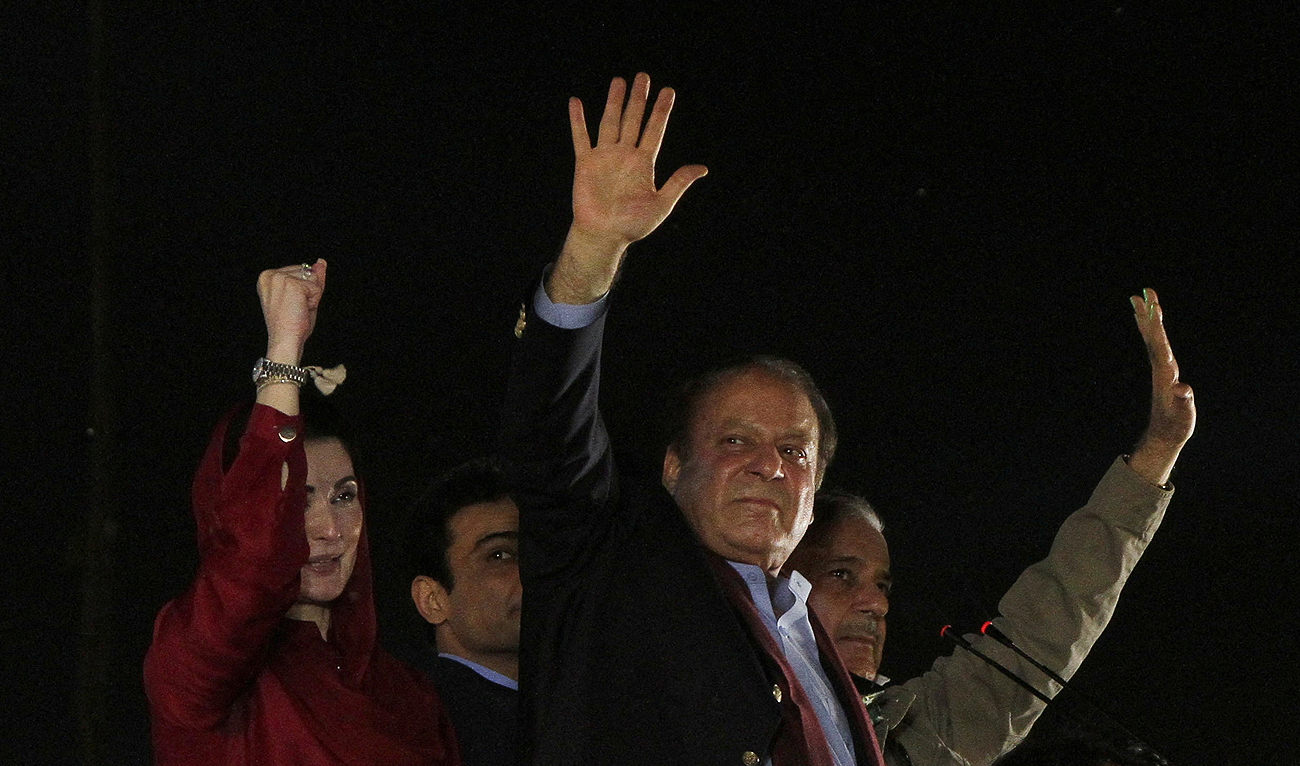 Pakistan's former Prime Minister Nawaz Sharif gestures to supporters upon his arrival from a self-imposed exile in London, ahead of the 2024 Pakistani general election, in Lahore, Pakistan, October 21, 2023. (REUTERS/File)