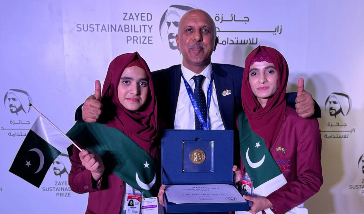 Ch Mohammed Akhtar (center), the Founding Chairman of Kashmir Orphan Relief Trust (KORT) with students Sumaiya Bibi (left) and Kinza Bibi after winning the Zayed Sustainability Prize for the best Global School in South Asia at Expo City in Dubai, UAE on December 1, 2023. (AN Photo)