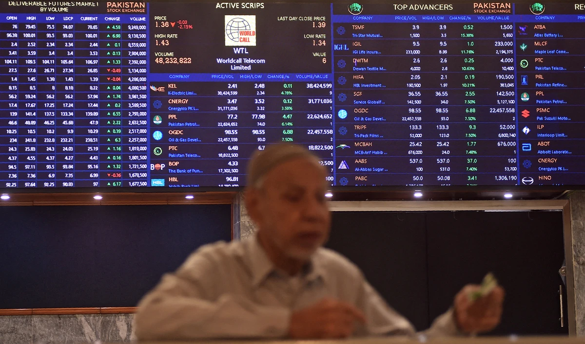 A stock broker watches share prices during a trading session at the Pakistan Stock Exchange (PSX) in Karachi on July 31, 2023. (AFP/File)